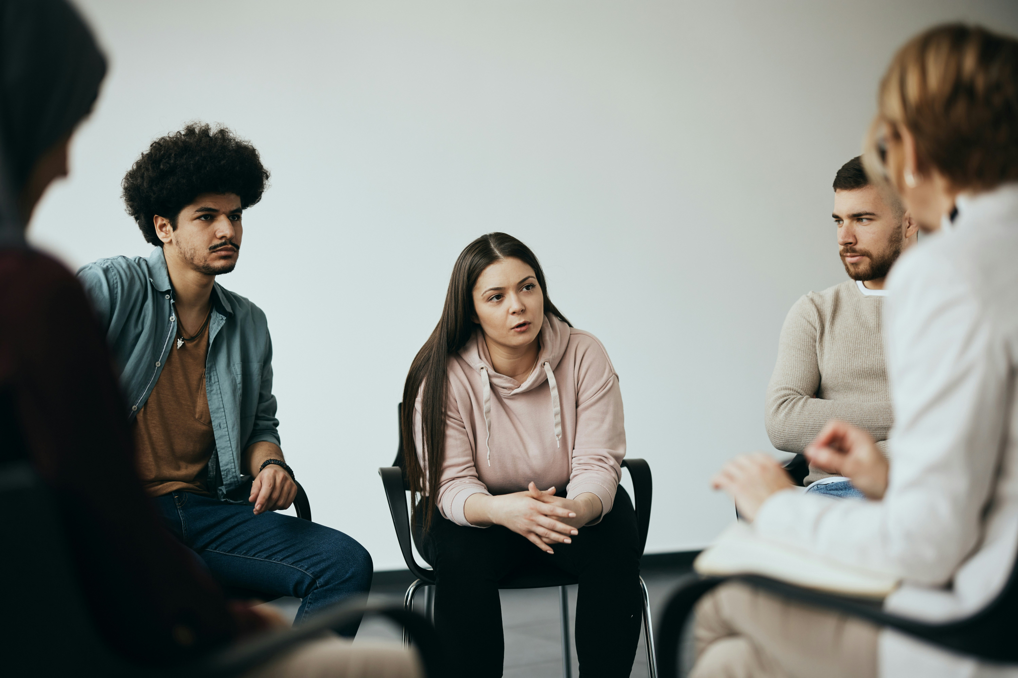 Community group woman speaking by getty images on unsplash