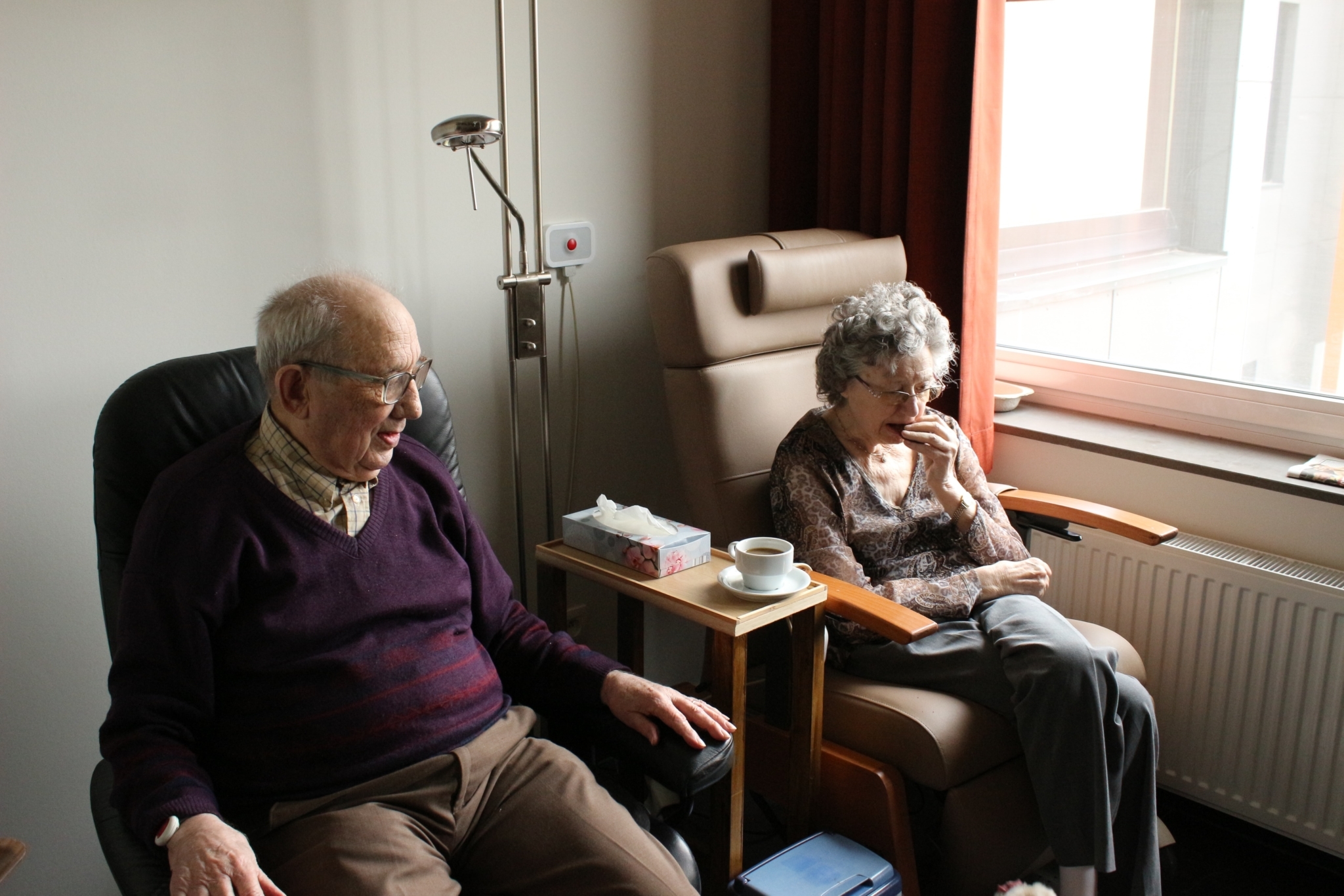 Elderly people in chairs