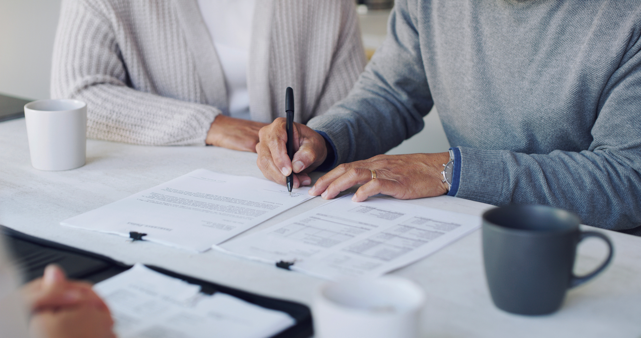 Image of people signing a will idea Jan 2023 legacy