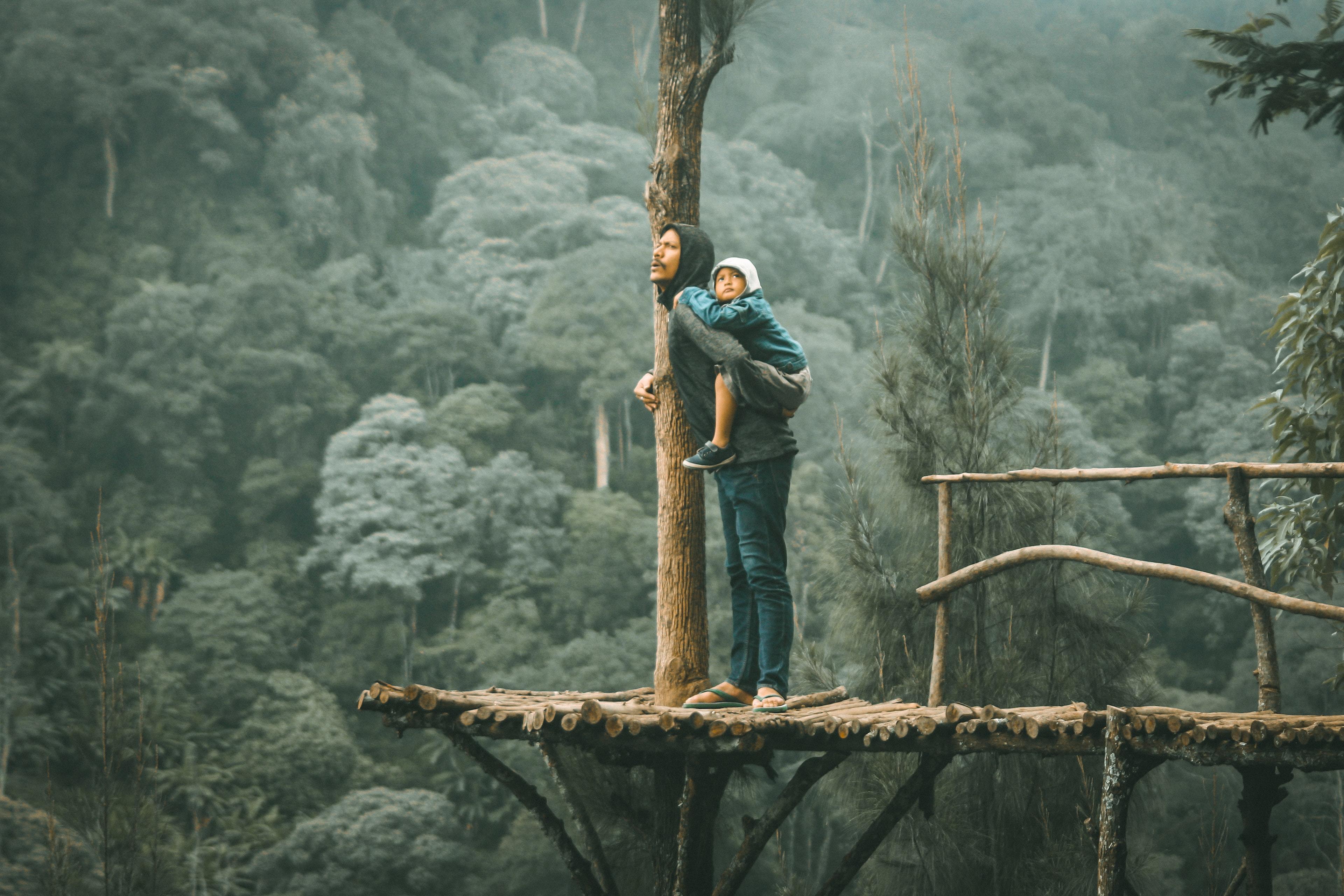 Man baby carrying leadership wilderness