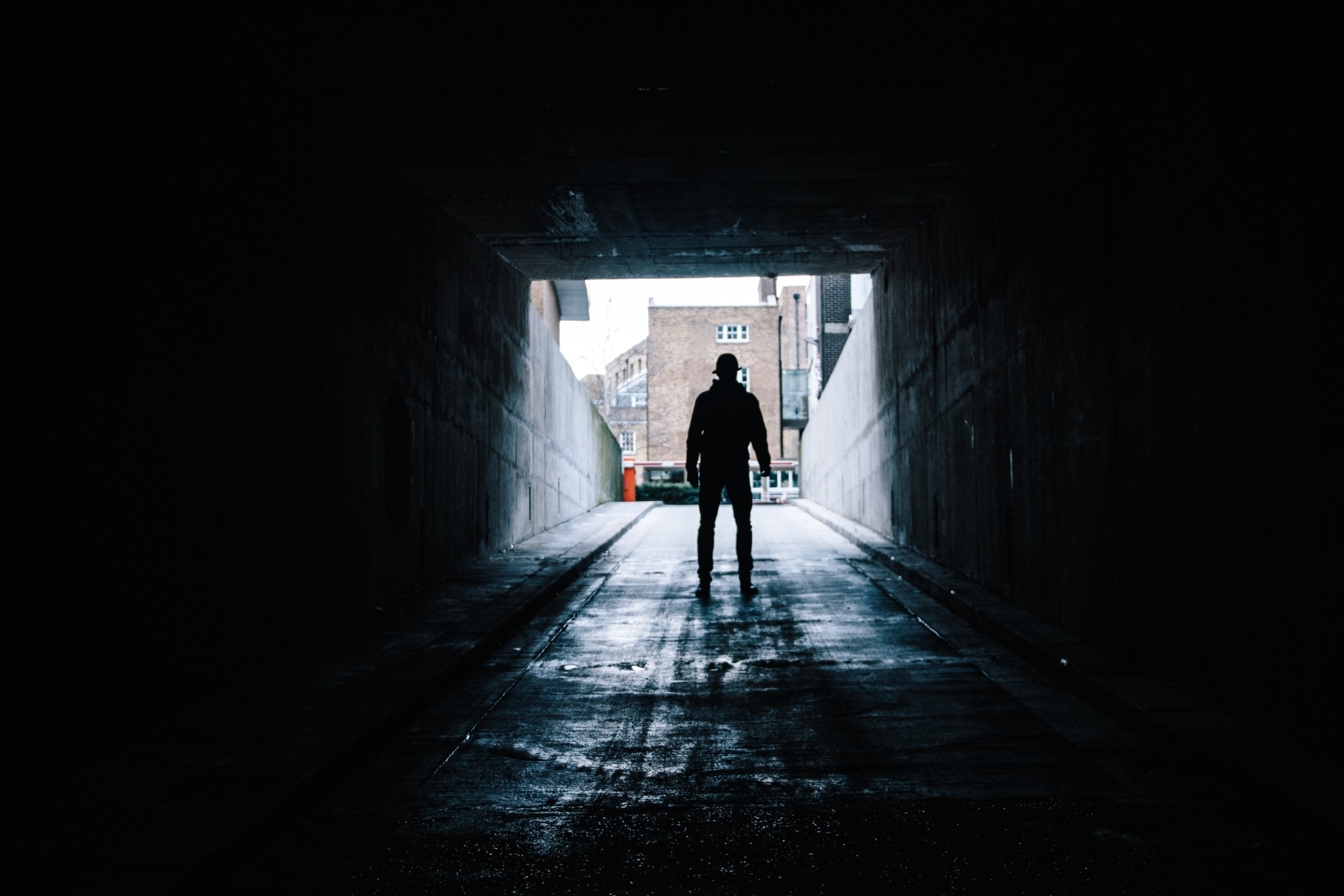 Man emerging from a tunnel